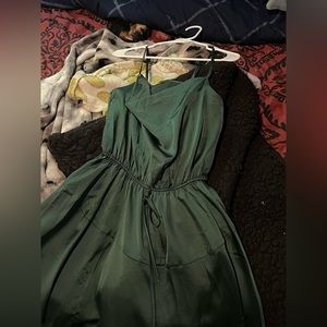 Flowing green dress length is short and long